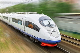 The Rust and Golang mascots riding in a bullet train