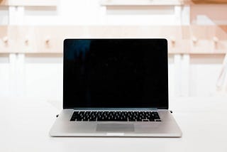 A silver laptop on a desk