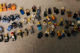Lots of Lego characters laid on a carpet as representing different personas