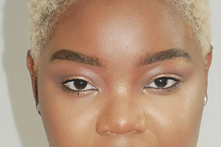 Black girl with short blonde hair