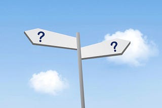 sign post with arrows pointing in opposite directions