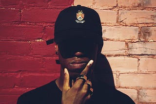 a gangster in a hat that covers his eyes. Diddy, sexuality