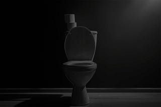 A toilet in a dark bathroom. Photo by New Africa Studio, Depositphotos, Altered in tone by Jeff Gates