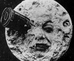 A rocketship has hit the right eye of the Man in the Moon.