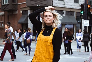 woman with hand on her head and a questioning look