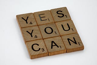 Photo of letter blocks saying YES YOU CAN