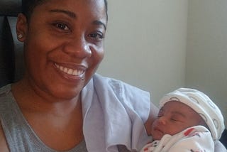 Picture of LaShonda, the author, holding her newborn niece.