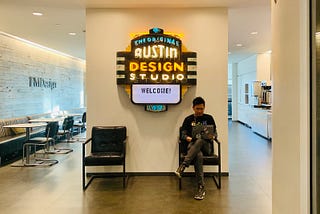 Me sitting in front of the IBM Austin Design Studio’s welcome neon sign, a popular ‘check-in’ spot for visitors to pose!