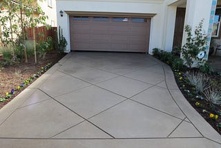 Why Choose A Coloured Concrete Driveway For Style, Durability, And Curb Appeal?