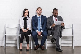 Source: https://depositphotos.com/184229582/stock-photo-multiethnic-young-business-people-waiting.html