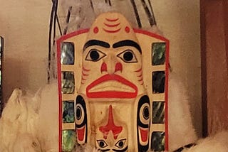 Haida carved headdress with black and red markings