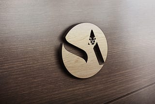 3d Logo of Smith Aegis Plc on wooden wall. Abbreviated S.A with lion shape above the A.