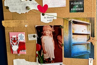 a cork bulletin board holds pieces of paper with little reminders like “know what you know,” and “pleasure is abundant” as well as a picture of the author as a young child and art of an empty bookshelf except one golden flower which a bee is heading to.