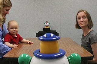 Photo caption: A 1-year-old baby follows the eye gaze of Rechele Brooks, of I-LABS, as she turns her head to look at a toy.