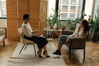 A young woman in a therapy session with her therapist
