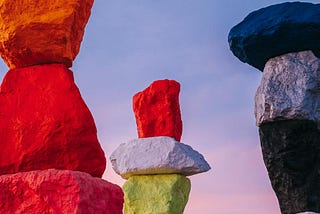 Building towers from huge colorful stones.