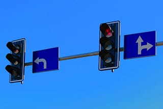 Two stop lights, one for turning left and one for going straight.