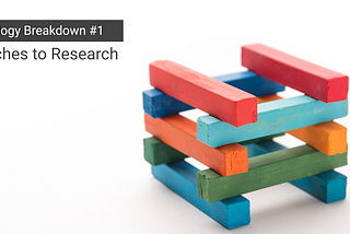 An image of bricks laid on top of each other. Text: Methodology Breakdown #1 - Approaches to Research