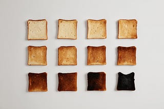 12 pieces of toast ranging from hardly toasted to burnt
