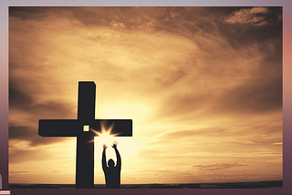 silhouette of a man praising on the cross