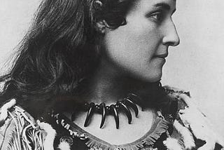 Mohawk Poet, Pauline Johnson, In profile with bear claw necklace and regalia