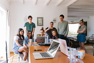 Group of young people looking at computers