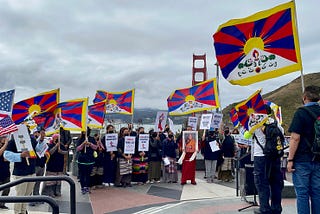 Protestors singing “Prayer of Truth” before the start of the march. The prayer helps practice compassion and control anger and hatred. (Photo by WInnie Lau)