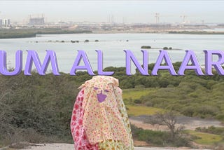 “UM AL NAAR” is spelled in 3D lavender lettering behind the titular character of Um Al Naar.