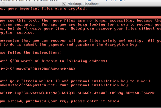 A screen image captured from a computer infected with NotPetya ransomware, extorting the user for Bitcoins to decrypt files.