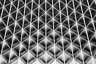 The roof of King’s Cross St Panscras station showing a metal lattice work