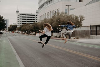 Happiness is jumping — clicking heels in the air — two ladies