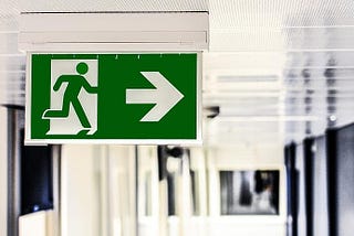Emergency exit sign with arrow pointing right