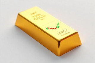 Gold bar with candlestick chart etched on top, symbolising the real upside beyond the 50% rally in gold mining stocks.