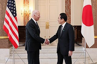 Joe Biden shaking hands with Japan Prime Minister Fumio Kishida