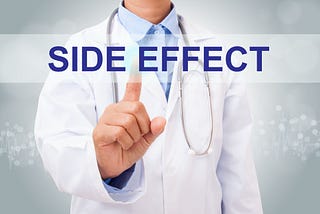 DOCTOR POINTING FINGER AT SIDE EFFECTS IN BLUE