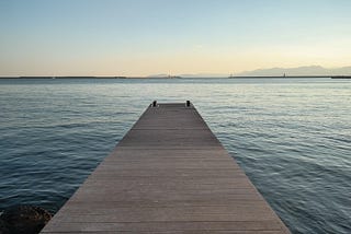 View from a wooden pier looking out to sea in Cagliari, Sardinia