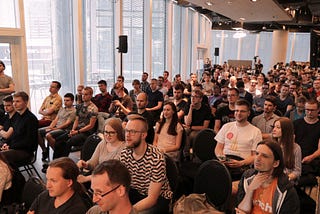 Photo from WarsawJS Meetup presents a crowded space at Warsaw Spire