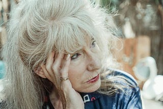 Sad older woman looking into the distance