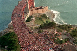 A massive crowd is on the Golden Gate bridge in San Francisco.