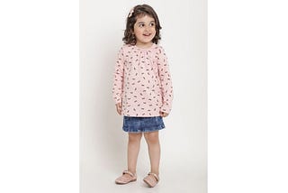 girl wearing berrytree organic dress