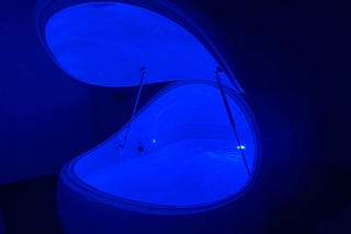 Image of floatation tank with blue light