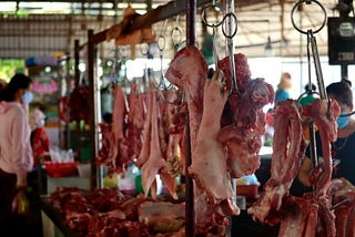 Meat market with customers.