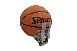 Photo of basketball in a prototype 3D printed baskeball prosthethic hand