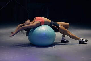 Is it possible to relieve back pain by sitting on an exercise ball?