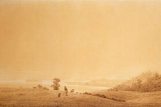 A sepia-toned landscape, mostly sky, with gently sloping grassy hills in the foreground. The ocean lies beyond, and some short trees or tall bushes are grouped here and there. In the foremost hill, a shepherd stands with a sheep.