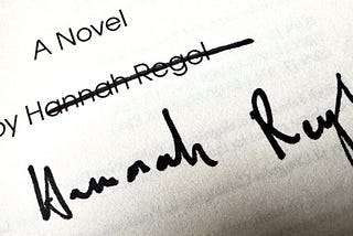 An autograph with crossed-out printed name.