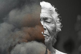 A black and white photo of an older woman’s face, half covered with clouds.