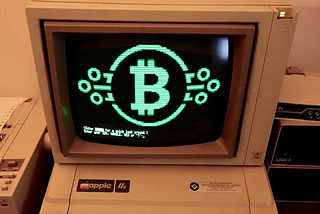 Washed-out picture of an old Apple computer showing the Bitcoin logo.