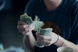 woman counting out cash