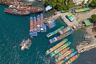 A bird’s eye view of fishing boats and sea in General Santos City Fish Port Complex. Mindanao, Philippines.